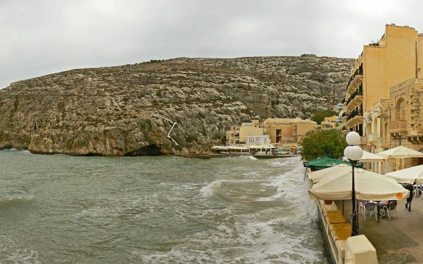 Xlendi Bay between steep limestone slopes