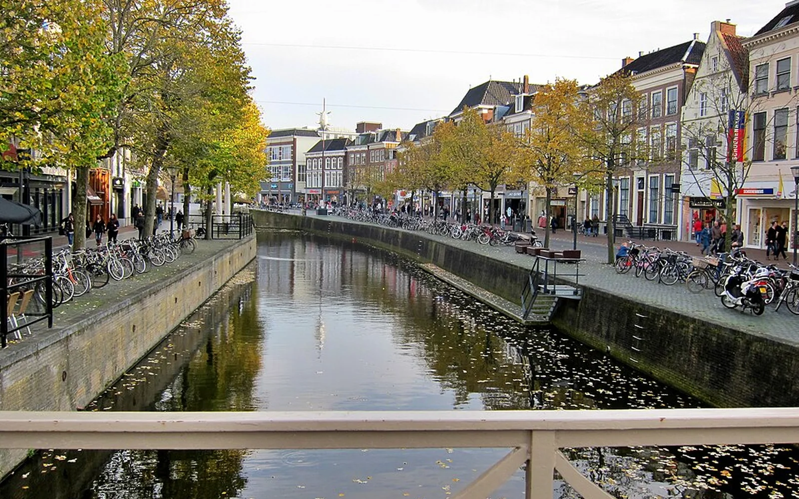 Canal, shops and bicycles along the Nieuwestad in Leeuwarden