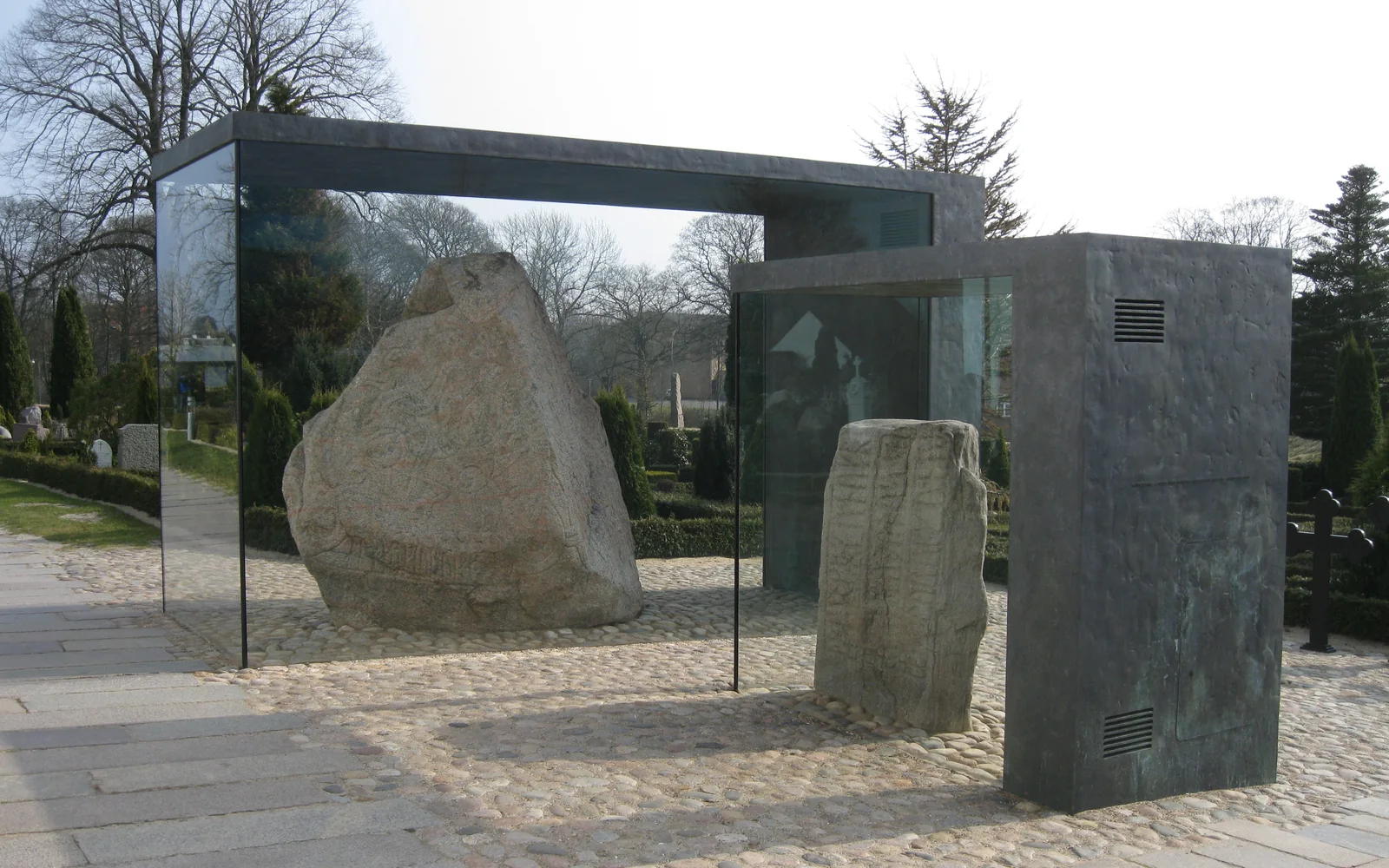 Jelling rune stones displayed between the burial mounds