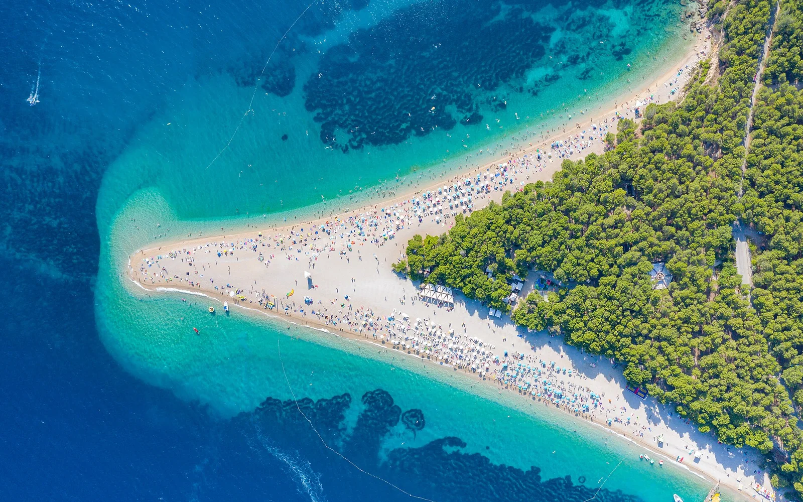 Zlatni Rat beach extending into the sea beside Bol
