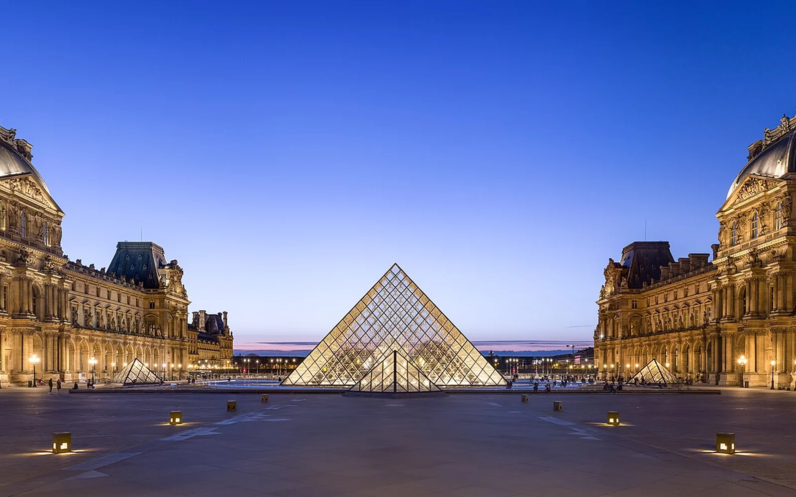 The Louvre courtyard and glass pyramid in Paris