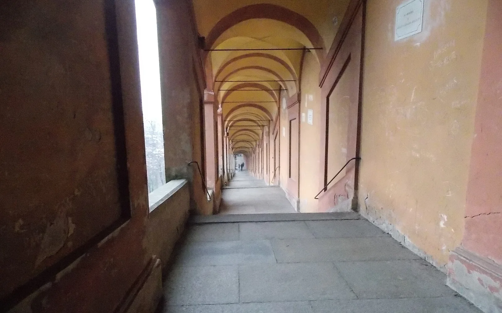 Covered porticoes along a street in Bologna