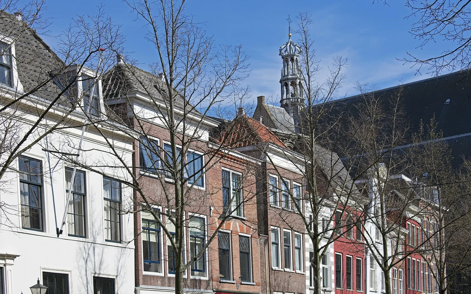 A canal lined with historic houses in Delft