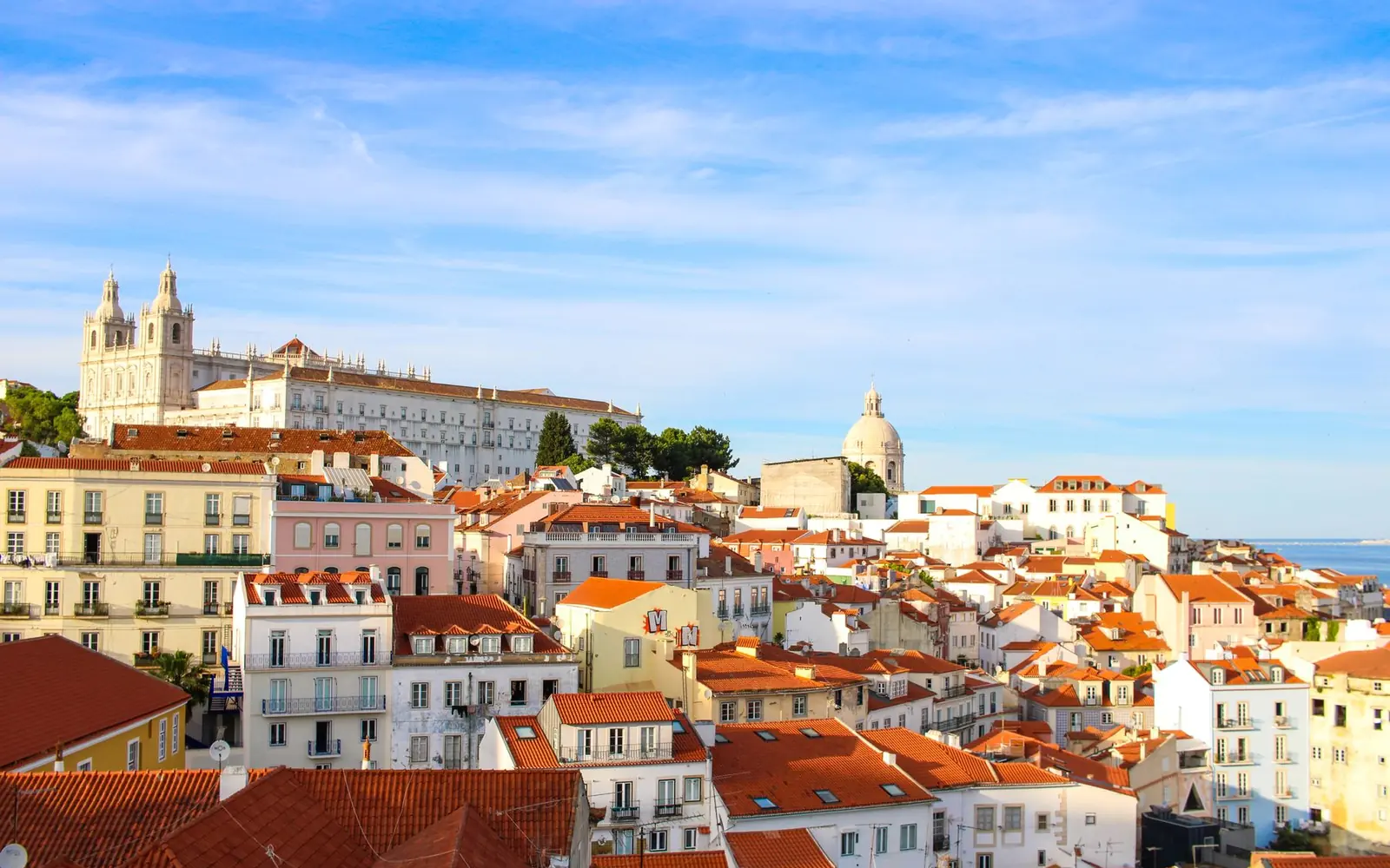 Lisbon rooftops and the towers of São Vicente de Fora above Alfama