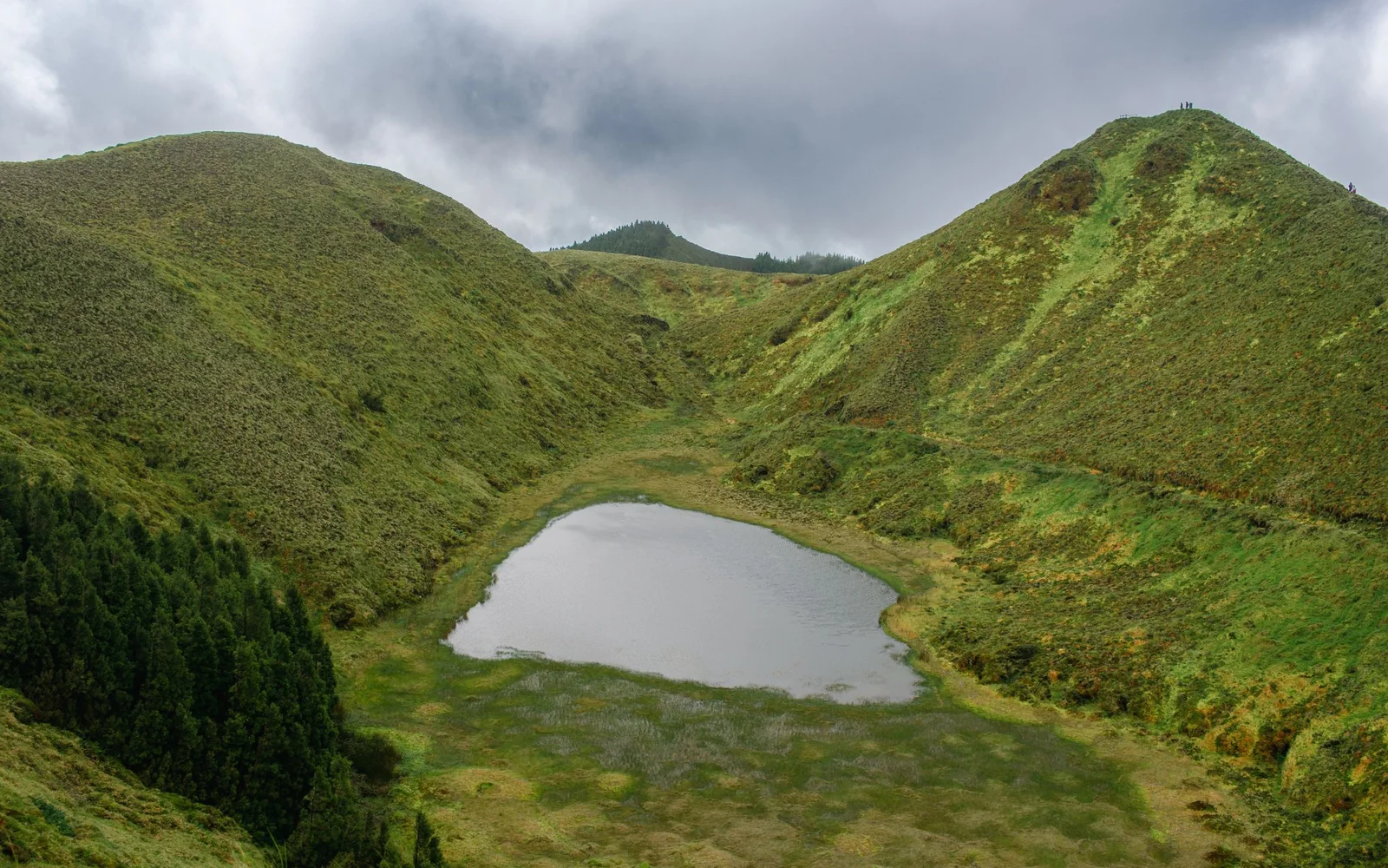 Volcanic crater lake and green hills in the Azores
