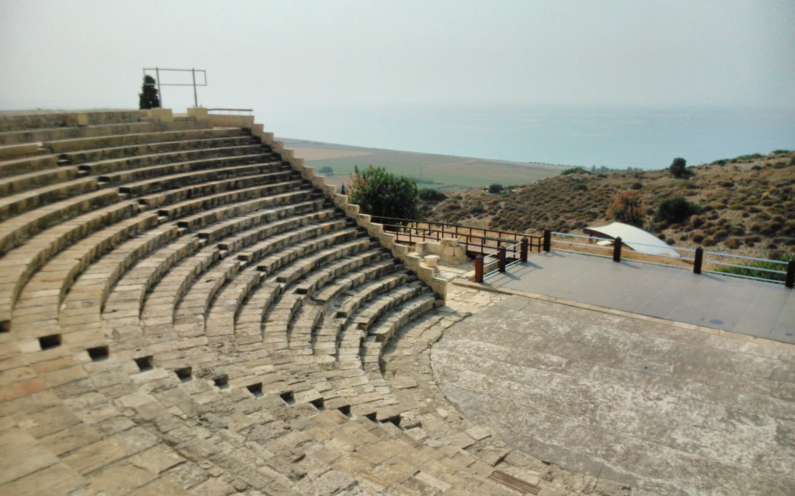 Stone seating of the Roman theatre at Kourion with the Cyprus coast beyond